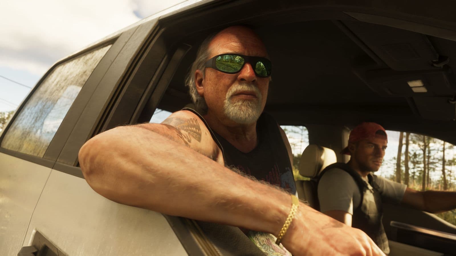 Brian Heder looking out of the passenger window of a car as Jason Duval drives