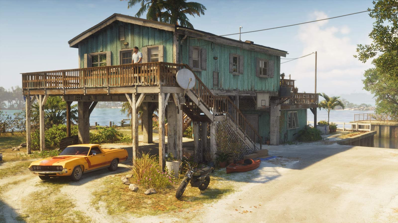 Jason’s stilt-house safehouse by the water, with an orange pickup and a dirt bike parked out front