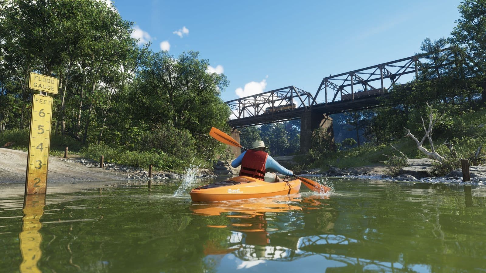 A kayaker in a life vest paddling towards a bridge in Mount Kalaga National Park
